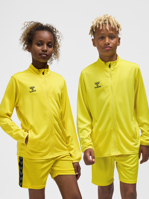 hmlESSENTIAL TRACK JACKET KIDS, BLAZING YELLOW, model
