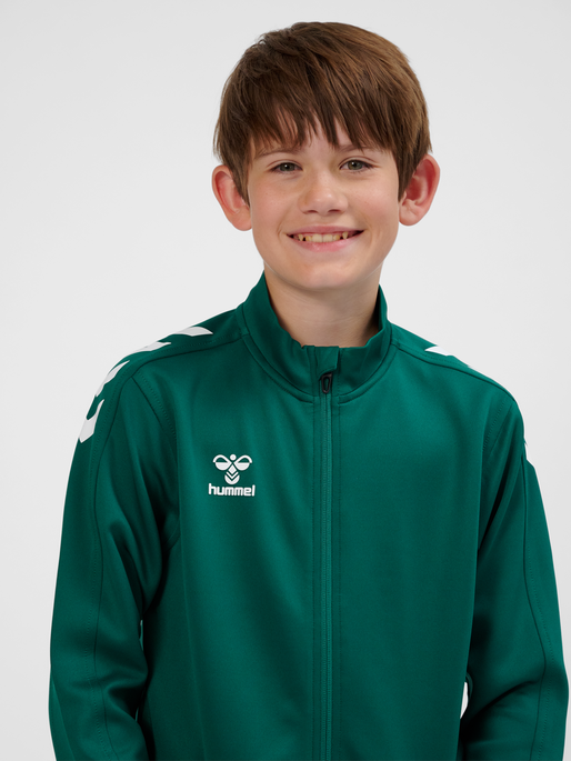 hmlCORE XK POLY ZIP SWEAT KIDS, EVERGREEN, model