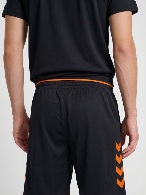 hmlCORE 2.0 SHORTS, BLACK/ORANGE TIGER, model