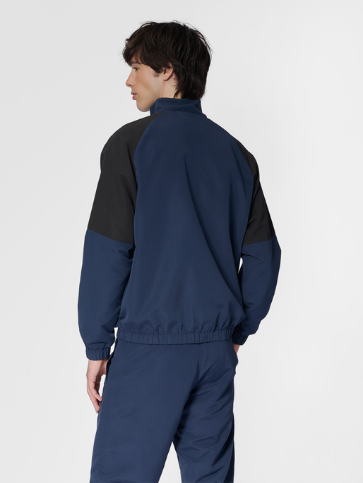 hmlTRACKSUIT JACKET SPORTSWEAR, DRESS BLUES, model