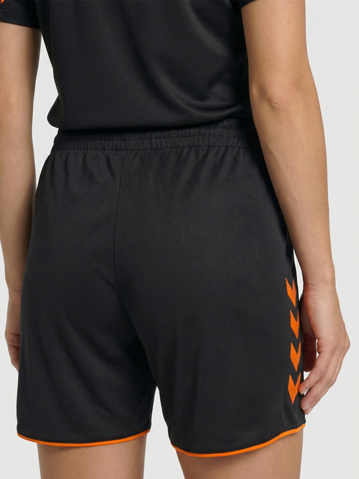 hmlCORE 2.0 SHORTS WOMAN, BLACK/ORANGE TIGER, model