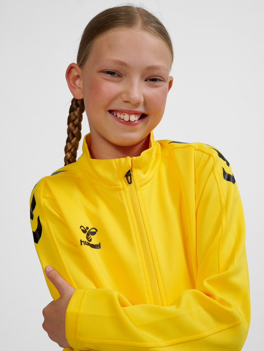 hmlCORE XK POLY ZIP SWEAT KIDS, SPORTS YELLOW, model
