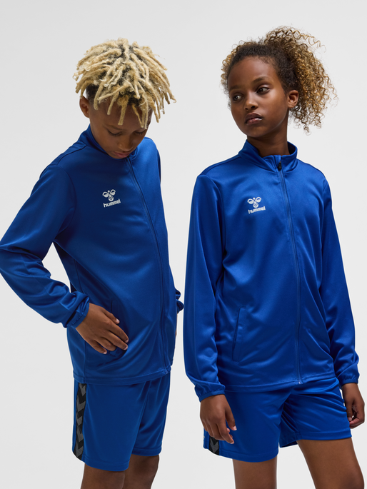 hmlESSENTIAL TRACK JACKET KIDS, TRUE BLUE, model